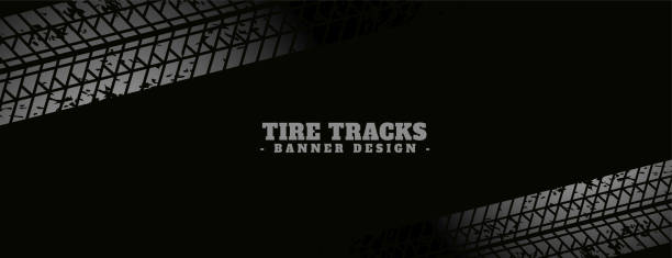 istock abstract tire track print mark on dark black banner design 2163865767