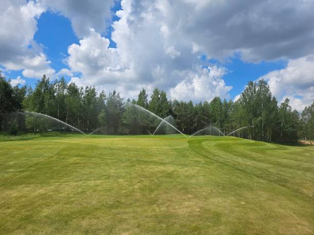istock Sprinkler system for watering a golf course on a sunny day 2163866300