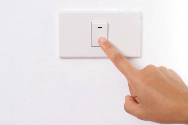 istock Turn on-off the light switch. to save electricity 2163867177