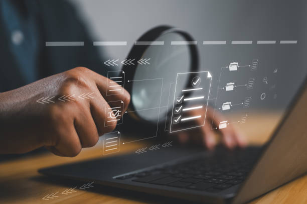 istock Businessman Inspecting Paperwork Document of Business Data Analysis working Management report with KPI and metrics connected to database. Corporate strategy for finance, operations, sales, marketing. 2163867197