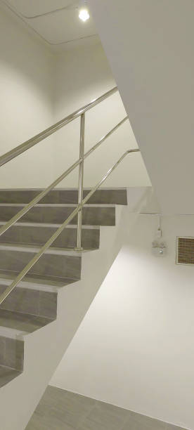 istock exit fire cement staircase wallway landing up or down in building 2163867279
