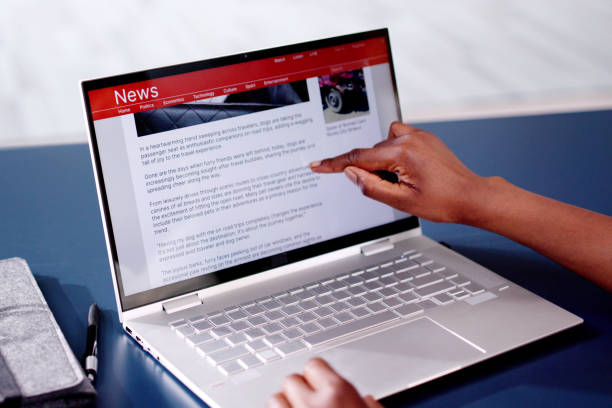 istock Watching News On Laptop Computer Screen Online 2163867998