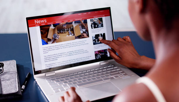istock Watching News On Laptop Computer Screen Online 2163867999
