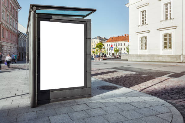 Mockup Of Blank Bus Stop Vertical Advertising Poster Billboard Mockup Of Blank Bus Stop Vertical Advertising Poster Billboard On Sidewalk bus shelter stock pictures, royalty-free photos & images