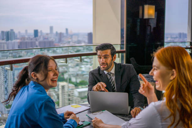istock White collar worker meeting at high rise tower. 2163875545