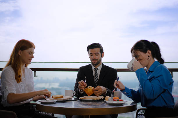 White collar worker meeting at high rise tower.