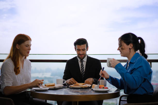 istock White collar worker meeting at high rise tower. 2163875567