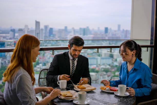istock White collar worker meeting at high rise tower. 2163875568