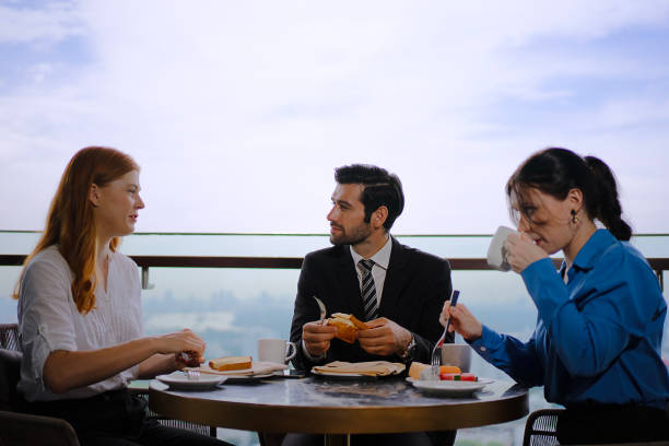 istock White collar worker meeting at high rise tower. 2163875569