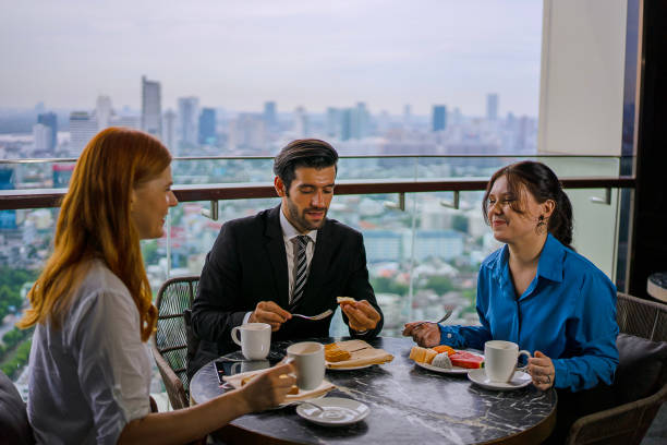 istock White collar worker meeting at high rise tower. 2163875573