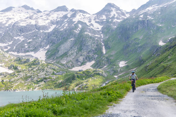 istock Cyclist Riding Along Mountain Path with Scenic Views 2163875859
