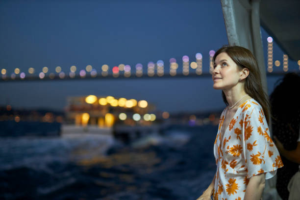 istock Beautiful lady enjoying bosphorus tour istanbul 2163878849