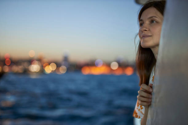 istock Beautiful lady enjoying bosphorus tour istanbul 2163878857