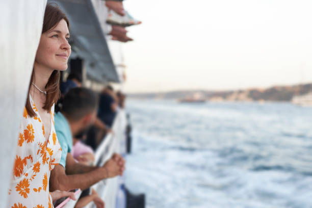 istock Beautiful lady enjoying bosphorus tour istanbul 2163878871