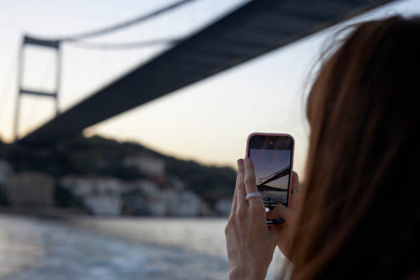 istock Beautiful lady enjoying bosphorus tour istanbul 2163878872