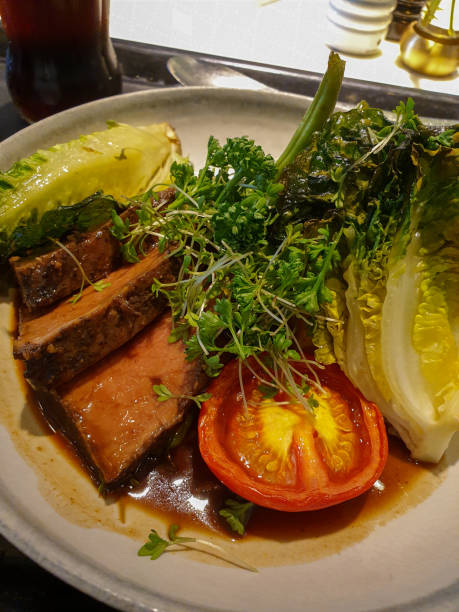 istock Dinner plate with meat, vegetables and tomato 2163879521