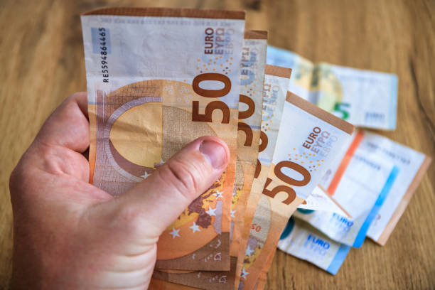 istock A man counting his savings in euros 2163879619