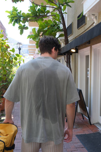 istock Sweat on the back of t-shirt from backpack 2163880886