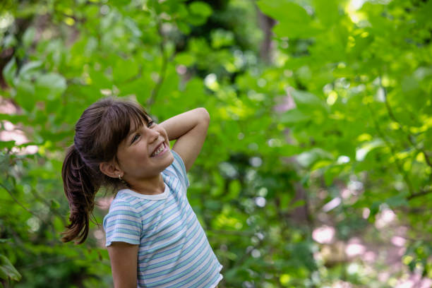 istock Child Portrait in Green Forest 2163881585
