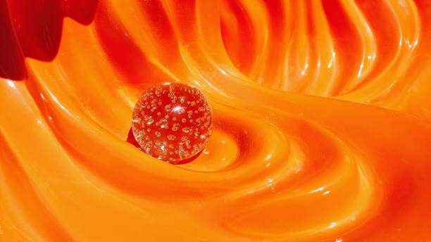 orange shiny background, crystal glass ball