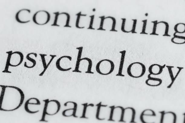 psychology printed word inside book paper background textured surface macro photography white space
