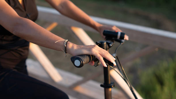 istock Close-up Woman hand holding bicycle 2163886751