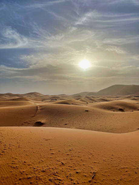 istock camel ride on sand dunes at sunset in erg chebbi desert 2163887310