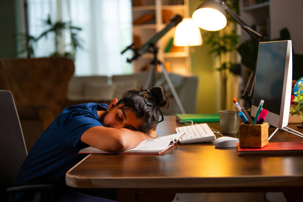 istock Indian asian small girl studying at home on computer desk 2163888945