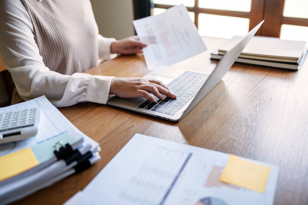 istock Business Professional Chartered Accountant Woman working with computer and calculator Sales Invoice Accounting 2163892802