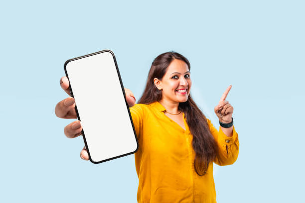 istock Indian asian young woman showing big smartphone with empty screen 2163894656