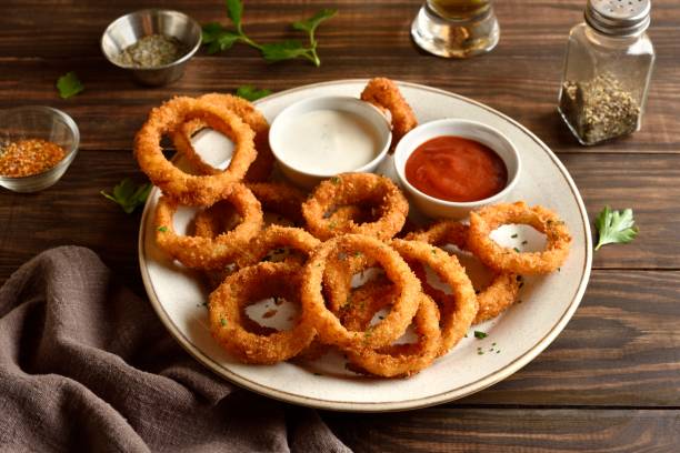 istock Fried breaded onion rings served with sauce 2163898160