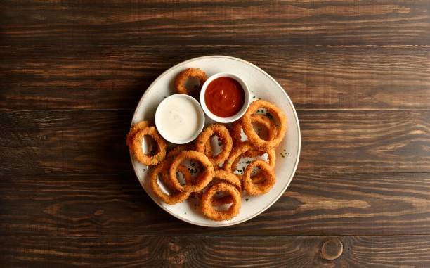 istock Fried breaded onion rings served with sauce 2163898188