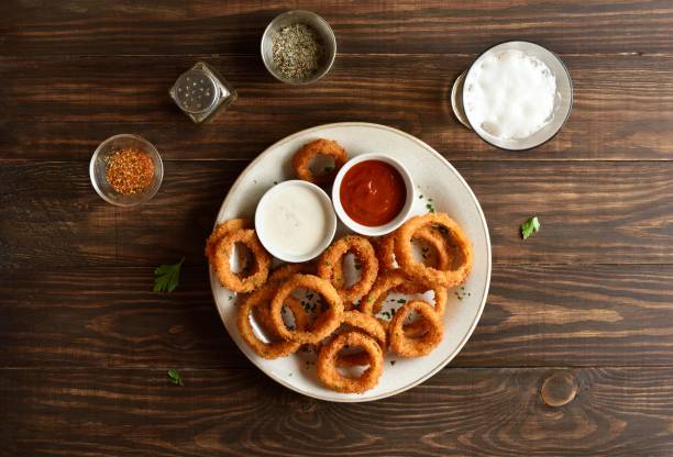 istock Fried breaded onion rings served with sauce 2163898201