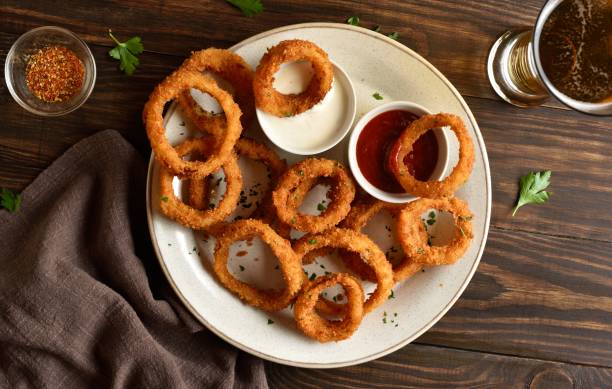 istock Fried breaded onion rings served with sauce 2163898226