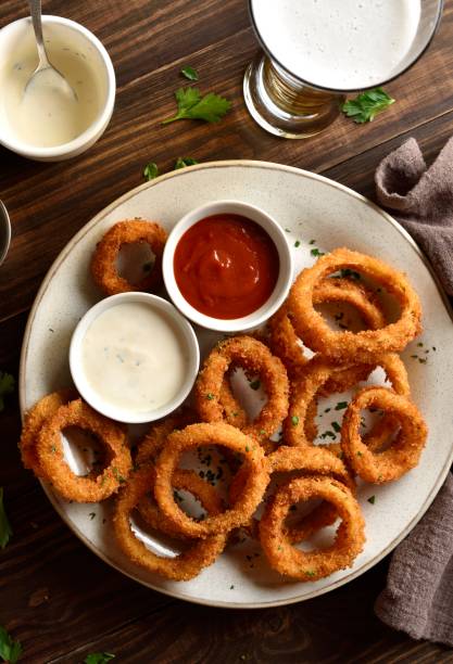 istock Fried breaded onion rings served with sauce 2163898231