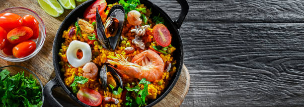 istock Seafood paella served in a cast iron pan 2163899328
