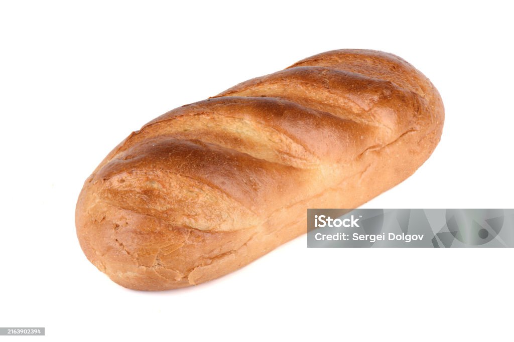 A whole fresh loaf of white bread on a white background. - Royaltyfri Bageri Bildbanksbilder A whole fresh loaf of white bread on a white background. - Royaltyfri Bageri Bildbanksbilder