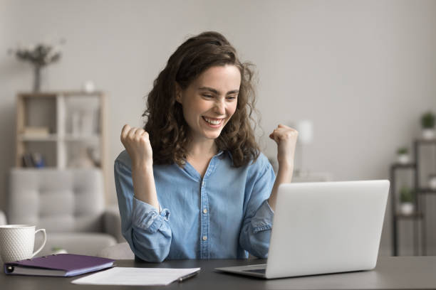 istock Young woman read e-mail with great news about university admission 2163905400