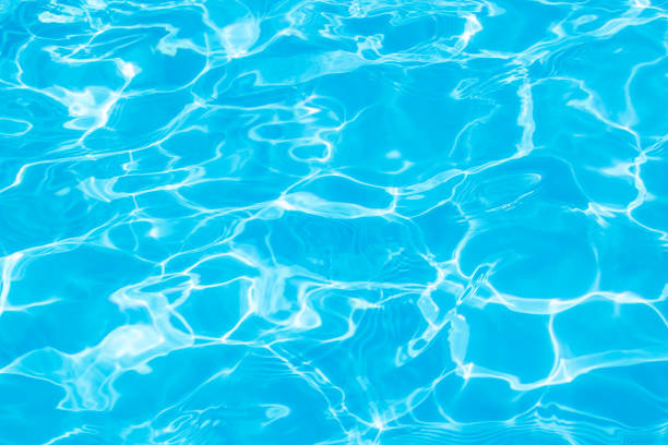 istock blue water surface background with ripples and sunray pool summer 2163908309