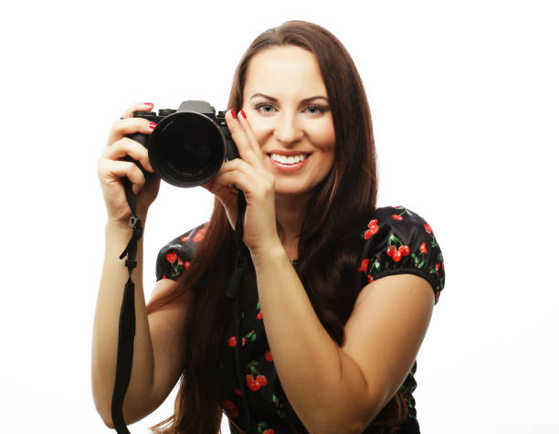 istock Cheerful young woman making photo 2163908585