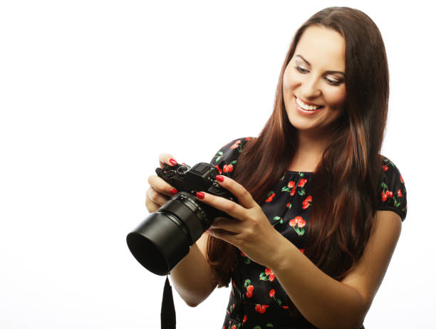 istock Cheerful young woman making photo 2163908587