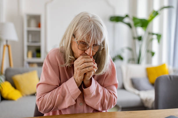 istock Senior woman trying to keep warm 2163910098