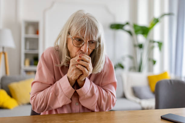 istock Senior woman trying to keep warm 2163910114