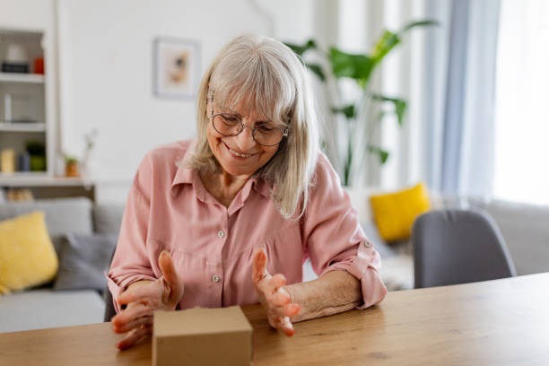 istock Elderly woman received a package 2163910829