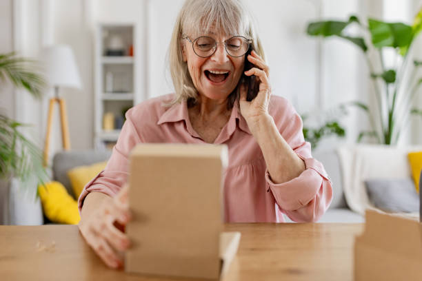 istock Elderly woman received a package 2163912202