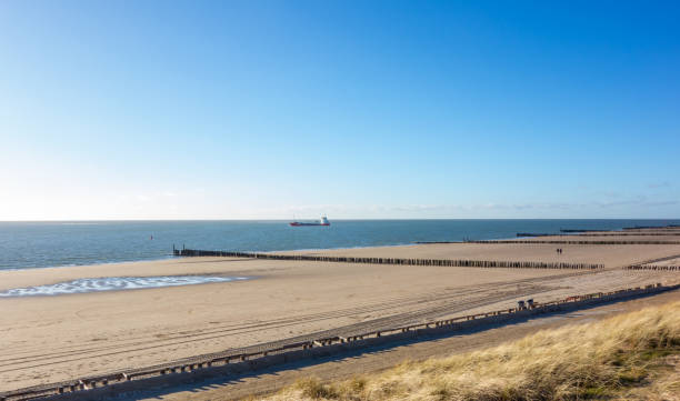 istock Ship passing the beach in Zeeland, Netherlands 2163913481