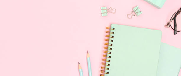 istock Banner with school supplies on a pink background. 2163914355