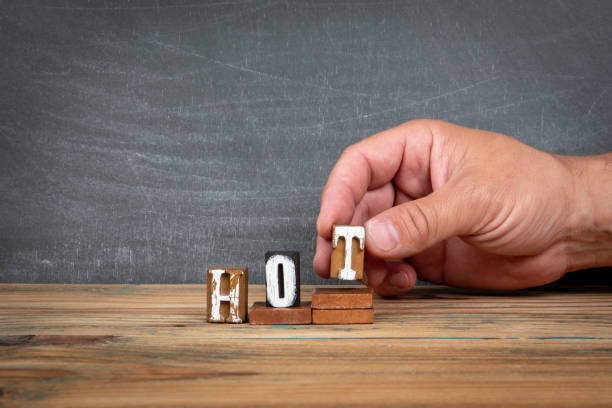 istock HOT. Wooden letters, alphabet blocks on steps. development and growth concept 2163915972