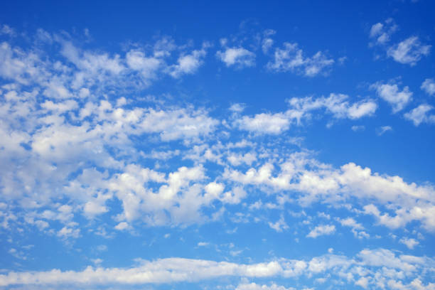 istock Beautiful fluffy white clouds in blue sky, background 2163917281