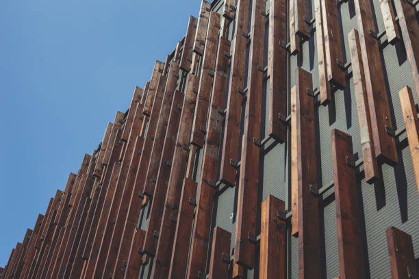 Modern urban architecture, innovative solution for facade design, facade cladding with boards. Modern design, selective focus
